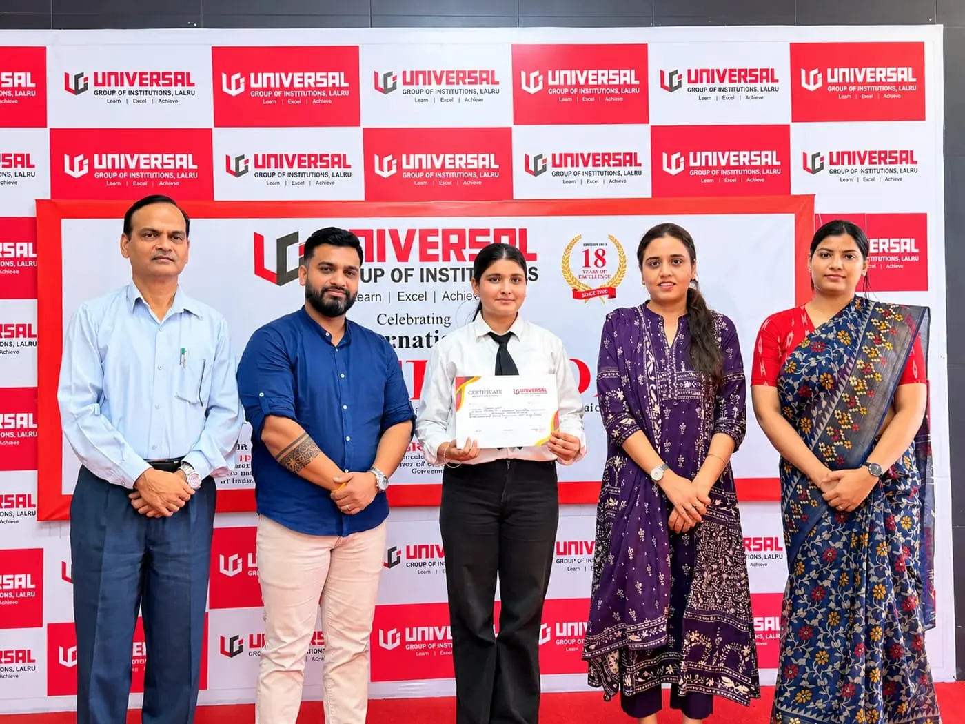 With faculty and a certified student at Universal Group of Institutions, Lalru
